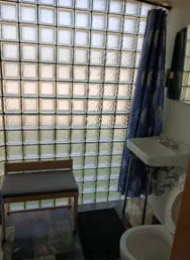 bathroom with glass block wall