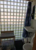 bathroom with glass block wall