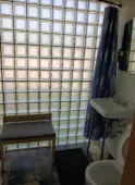 bathroom with glass block wall